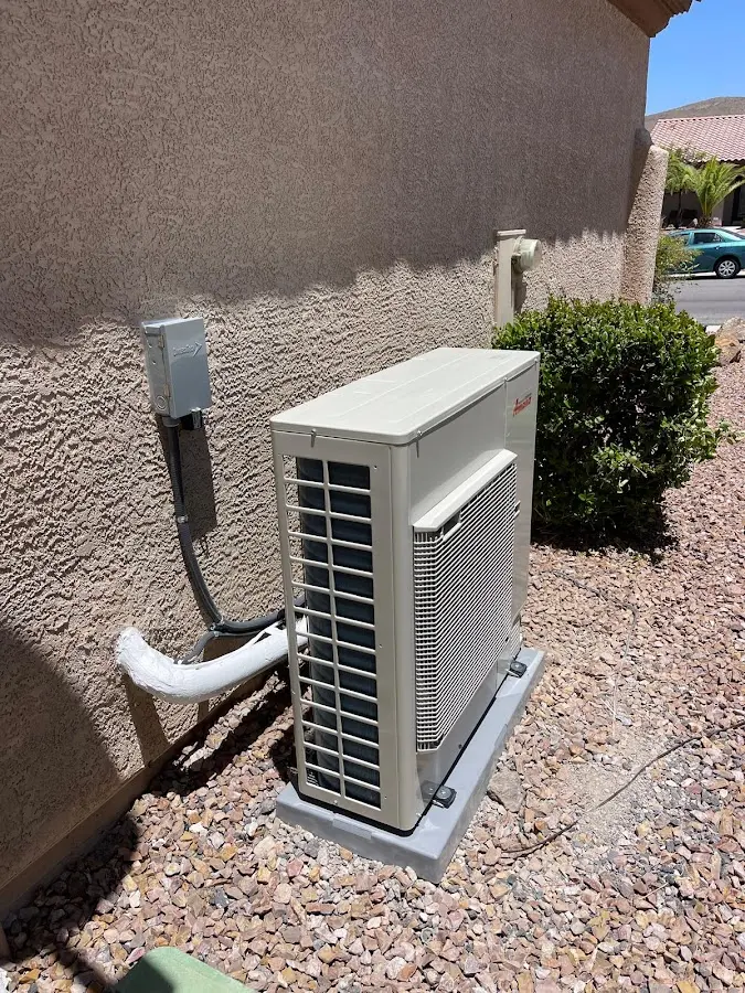 Residential air conditioning condenser unit in Kerman